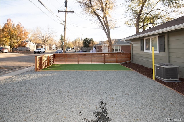 view of yard with central AC