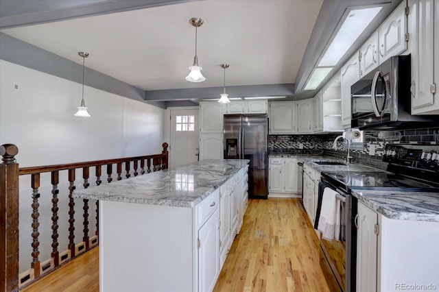 1641 Orchard Dr, Denver, CO 80221 - kitchen with stainless steel appliances, a sink, white cabinetry, backsplash, and a center island