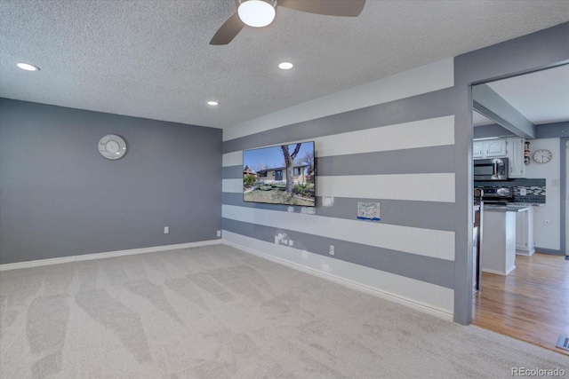 1641 Orchard Dr, Denver, CO 80221 - home theater room with a textured ceiling, light colored carpet, ceiling fan, recessed lighting, and baseboards