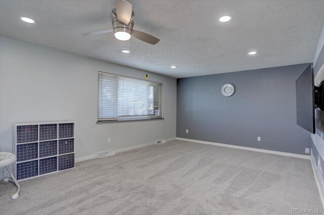 1641 Orchard Dr, Denver, CO 80221 - unfurnished living room featuring carpet floors, a textured ceiling, recessed lighting, ceiling fan, and baseboards