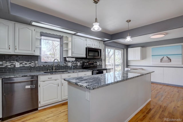 1641 Orchard Dr, Denver, CO 80221 - kitchen featuring stainless steel appliances, a sink, dark stone counters, open shelves, and white cabinets