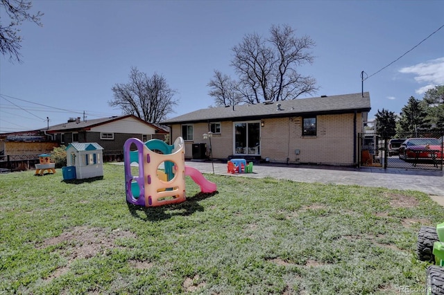 1641 Orchard Dr, Denver, CO 80221 - back of house featuring brick siding, central air condition unit, a patio, and a gate