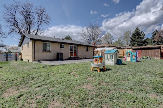 1641 Orchard Dr, Denver, CO 80221 - back of house with a patio, brick siding, a playground, and cooling unit