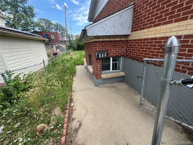 888 Wolff St, Denver, CO 80204 - view of side of property featuring brick siding