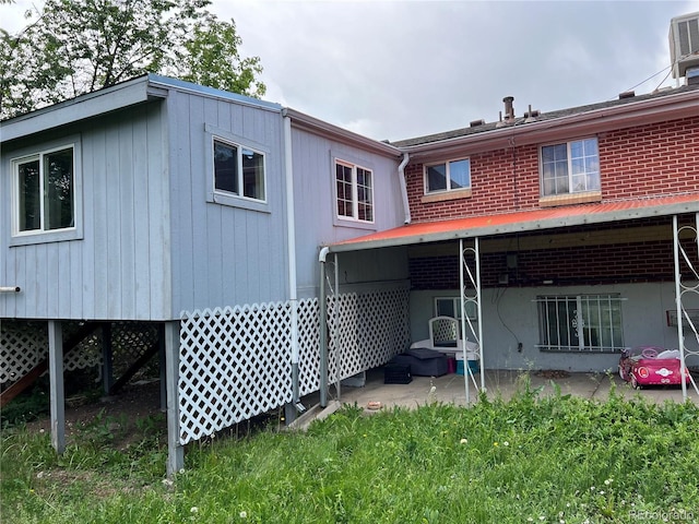888 Wolff St, Denver, CO 80204 - back of house featuring a patio area and brick siding