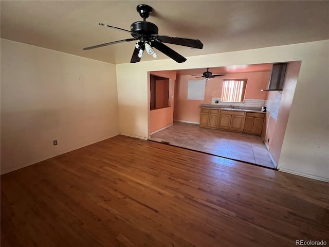 888 Wolff St, Denver, CO 80204 - unfurnished living room with light wood-type flooring and ceiling fan