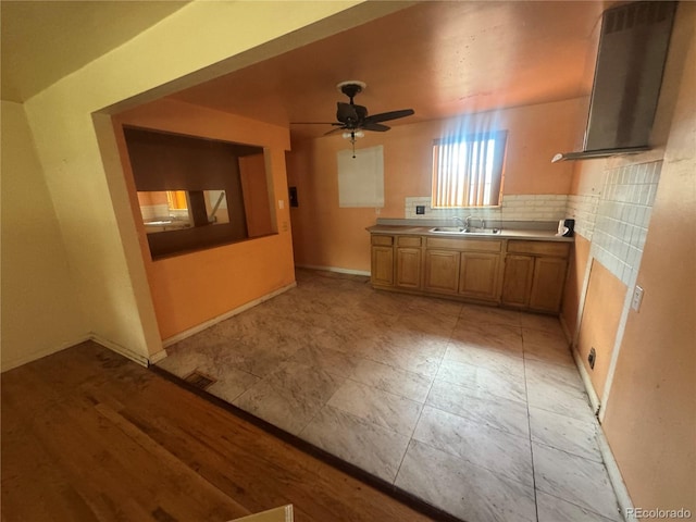 888 Wolff St, Denver, CO 80204 - kitchen with a ceiling fan and wall chimney exhaust hood