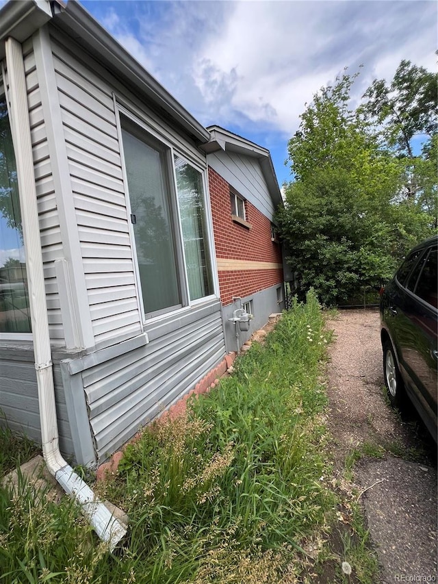888 Wolff St, Denver, CO 80204 - view of property exterior featuring brick siding