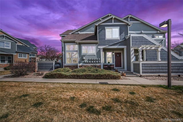 14300 Waterside Ln Unit J4, Broomfield, CO 80023 - view of front of house featuring a yard and a pergola