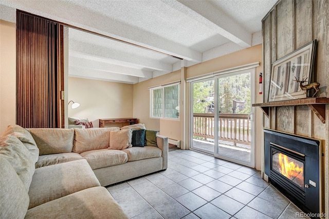 200 Granite St Unit 202, Frisco, CO 80443 - living area with a textured ceiling, beamed ceiling, a large fireplace, and light tile patterned floors