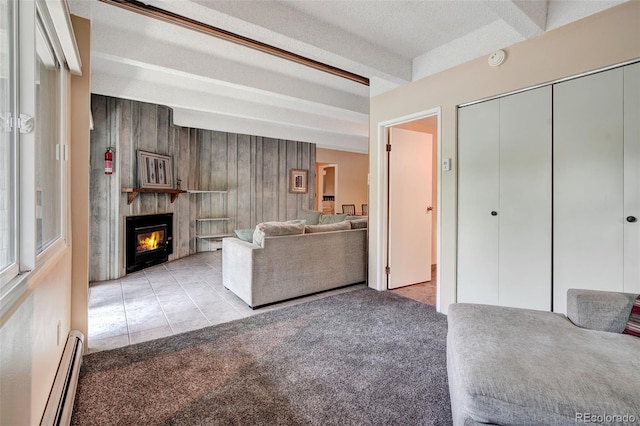 200 Granite St Unit 202, Frisco, CO 80443 - living room with a baseboard heating unit, a large fireplace, carpet flooring, and tile patterned flooring