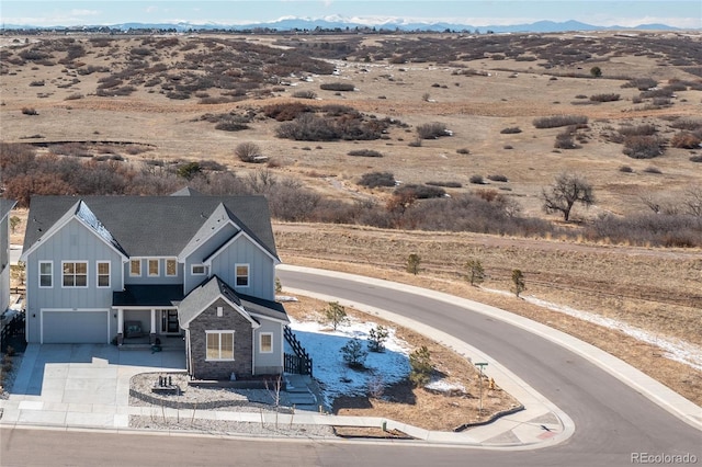 drone / aerial view with a mountain view and a desert view