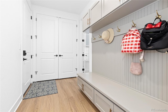 mudroom with light wood-style floors