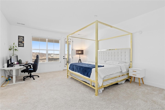 bedroom with baseboards, visible vents, and carpet floors