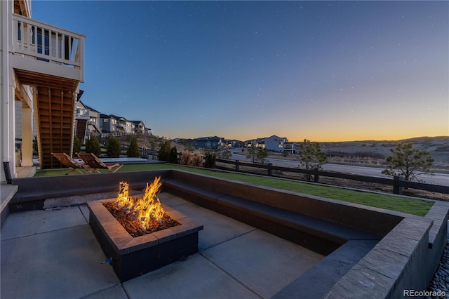 view of patio / terrace featuring stairway, a residential view, and an outdoor fire pit