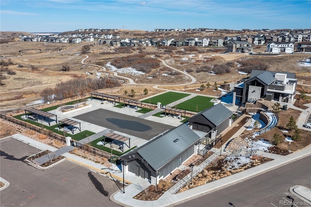 birds eye view of property with a residential view