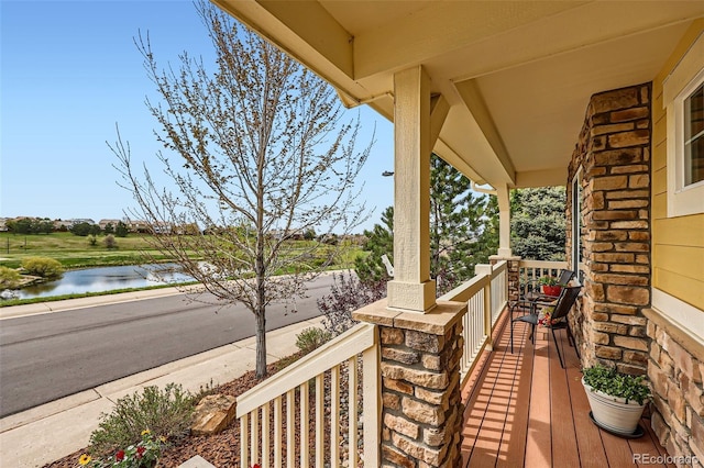 2872 Dreamcatcher Loop, Castle Rock, CO 80109 - wooden porch with a water view