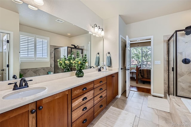 2872 Dreamcatcher Loop, Castle Rock, CO 80109 - bathroom with double vanity, a stall shower, and ensuite bath