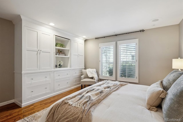 bedroom featuring baseboards, recessed lighting, and light wood-style floors