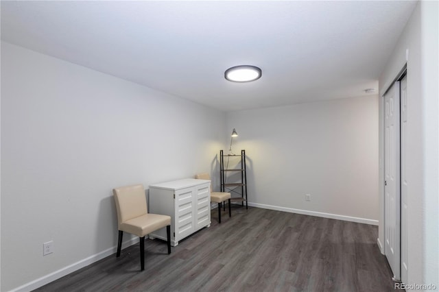 office featuring dark wood-type flooring and baseboards