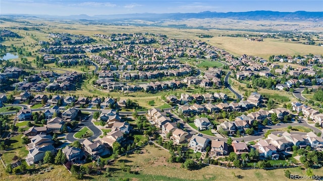 aerial view featuring a mountain view and a residential view
