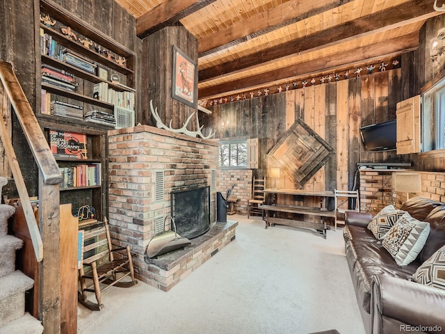 living room featuring beam ceiling, wooden walls, carpet, and wooden ceiling