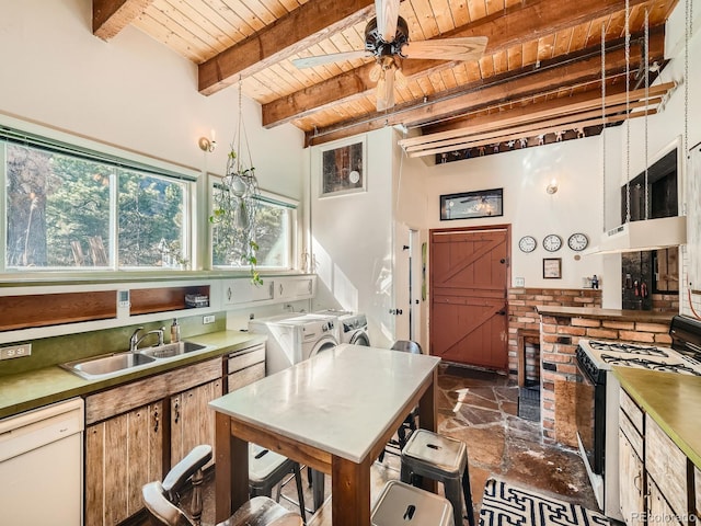 kitchen featuring washer and clothes dryer, beam ceiling, wooden ceiling, sink, and white appliances