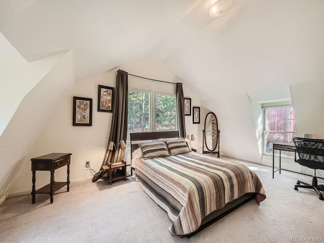 bedroom featuring carpet floors and vaulted ceiling