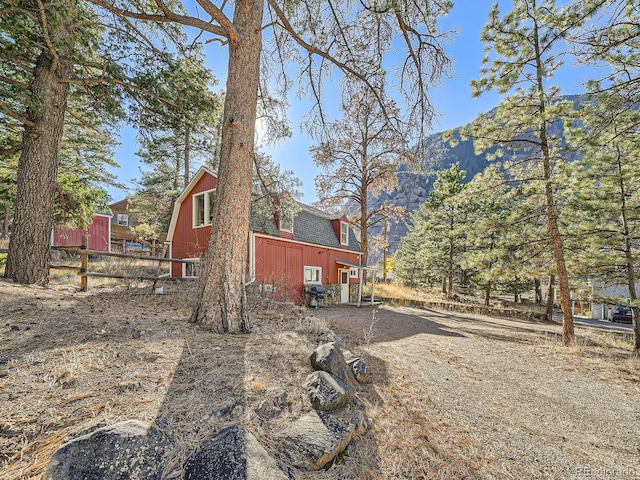 view of side of property featuring a mountain view