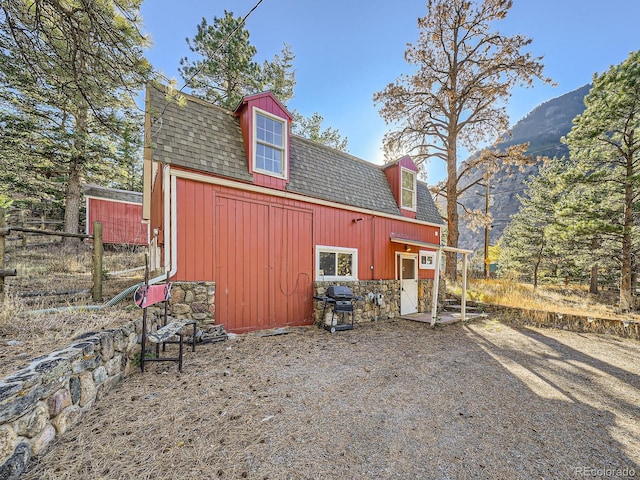 view of outdoor structure with a mountain view