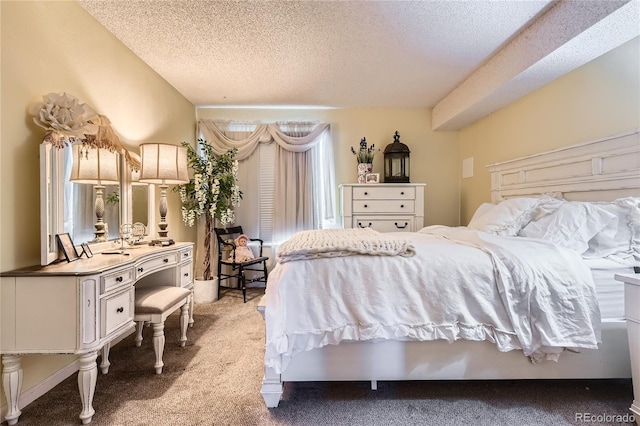 carpeted bedroom featuring a textured ceiling