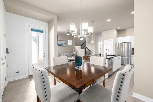 1928 W 67th Pl, Denver, CO 80221 - dining room featuring light wood-type flooring, baseboards, a chandelier, and recessed lighting