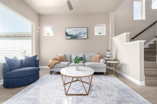 1928 W 67th Pl, Denver, CO 80221 - living area with ceiling fan, stairs, baseboards, and wood finished floors