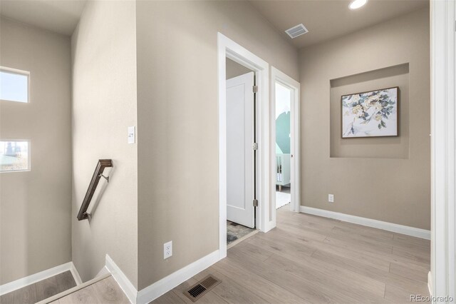 1928 W 67th Pl, Denver, CO 80221 - hall featuring an upstairs landing, light wood finished floors, baseboards, and recessed lighting