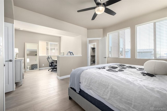 1928 W 67th Pl, Denver, CO 80221 - bedroom featuring baseboards, a desk, light wood finished floors, and ceiling fan