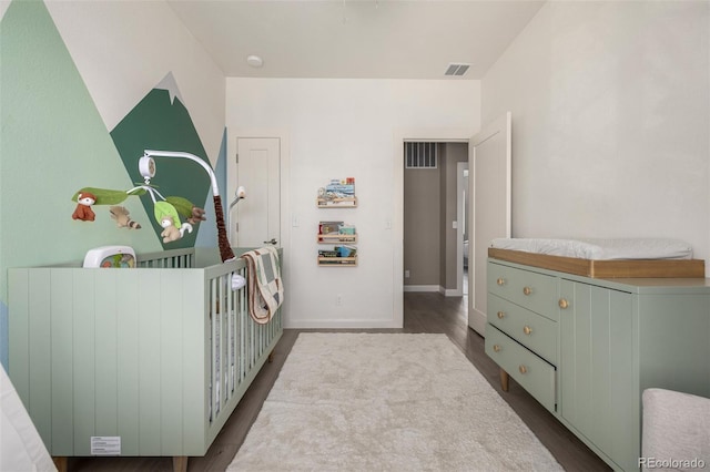 1928 W 67th Pl, Denver, CO 80221 - bedroom featuring dark wood finished floors and baseboards