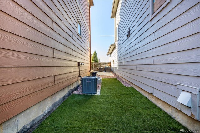 1928 W 67th Pl, Denver, CO 80221 - view of side of home featuring cooling unit