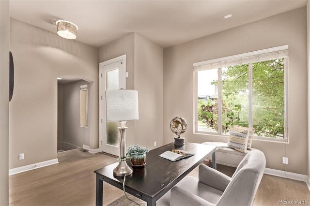 1928 W 67th Pl, Denver, CO 80221 - office area featuring arched walkways and wood finished floors