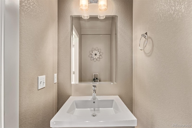 1928 W 67th Pl, Denver, CO 80221 - bathroom with a textured wall and a sink