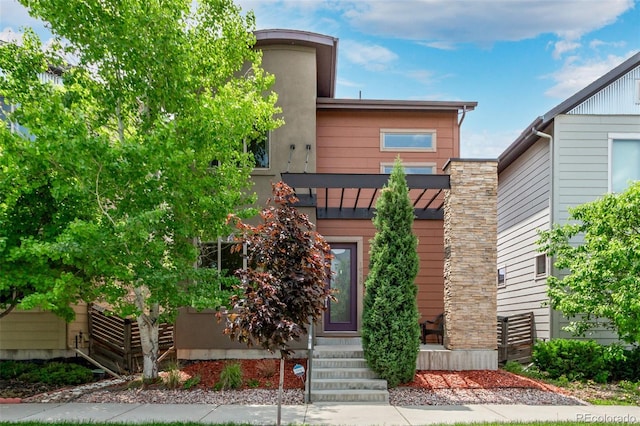 1928 W 67th Pl, Denver, CO 80221 - view of front facade featuring entry steps and a standing seam roof