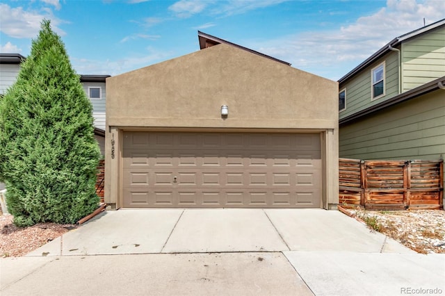 1928 W 67th Pl, Denver, CO 80221 - garage featuring concrete driveway