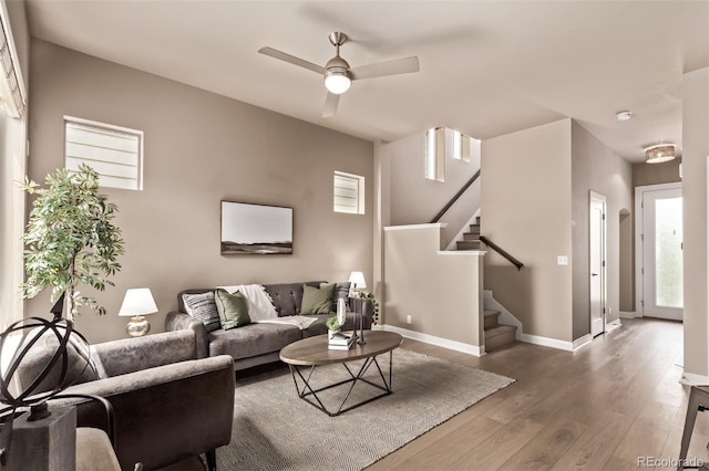 1928 W 67th Pl, Denver, CO 80221 - living area with stairs, a ceiling fan, and wood finished floors
