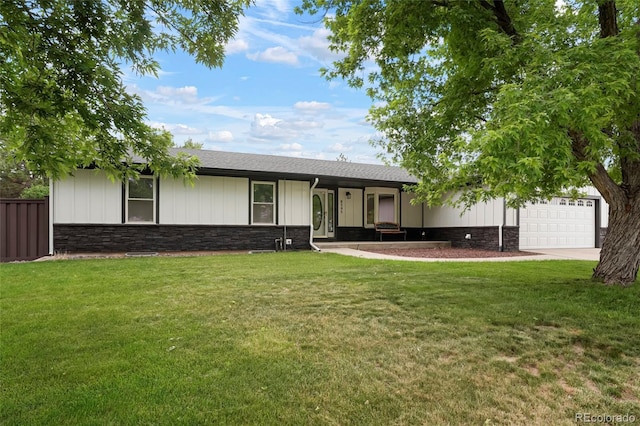 8595 S Yarrow St, Littleton, CO 80128 - ranch-style house featuring stone siding, concrete driveway, a garage, and board and batten siding