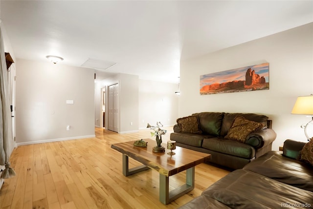 8595 S Yarrow St, Littleton, CO 80128 - living area with light wood-style floors and baseboards