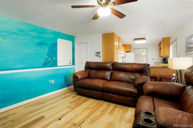 8595 S Yarrow St, Littleton, CO 80128 - living area with light wood-type flooring and a ceiling fan