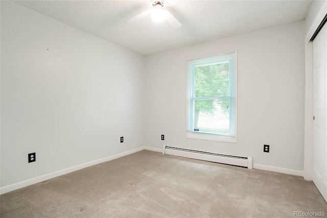 8595 S Yarrow St, Littleton, CO 80128 - empty room with a baseboard radiator, light colored carpet, a ceiling fan, and a textured ceiling