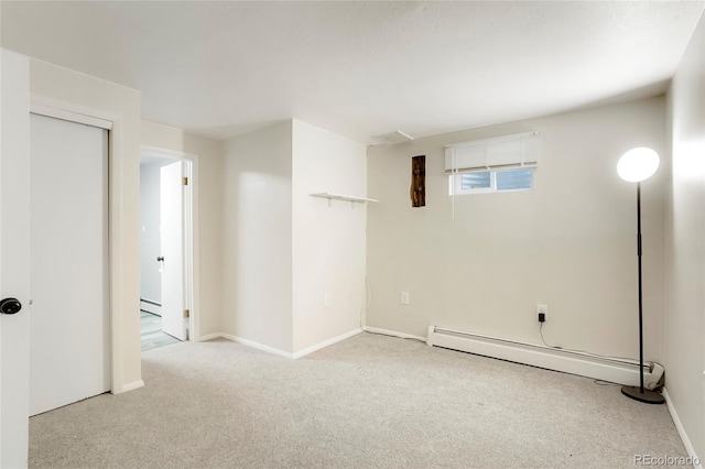 8595 S Yarrow St, Littleton, CO 80128 - basement with a baseboard heating unit and carpet