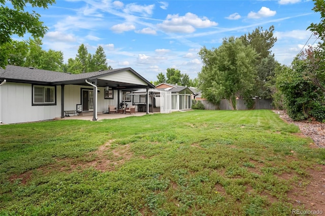 8595 S Yarrow St, Littleton, CO 80128 - view of yard with a patio and a sunroom