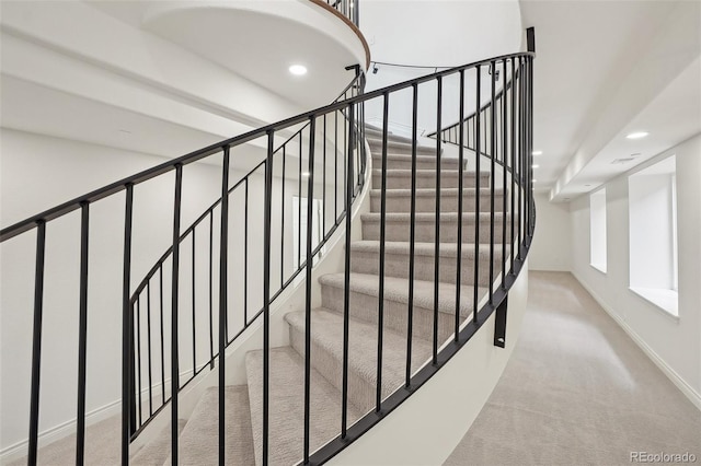 staircase with carpet, baseboards, and recessed lighting