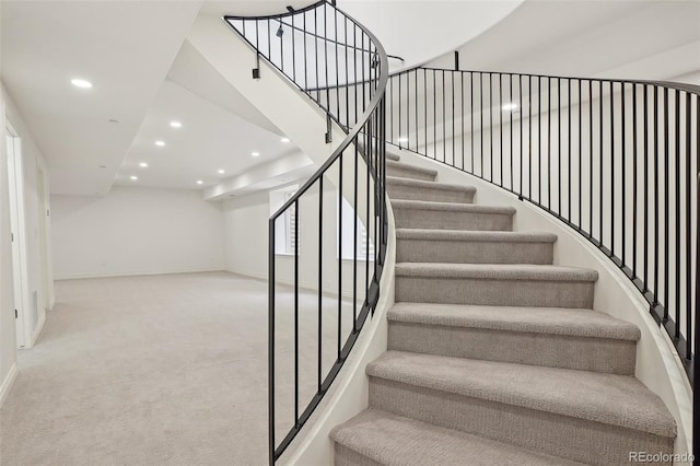 stairway featuring carpet, baseboards, and recessed lighting